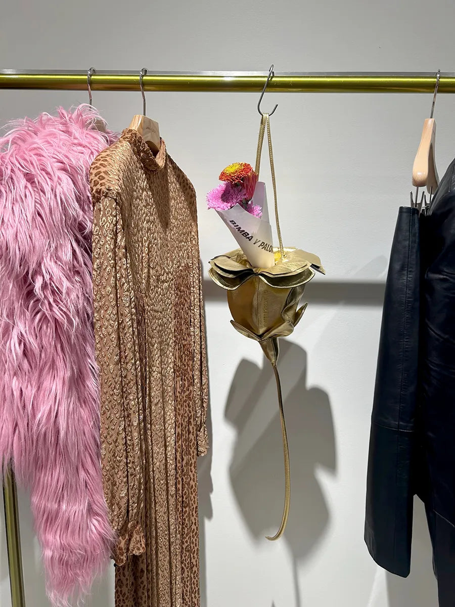Pink fur coat, gold dress, floral gold bag