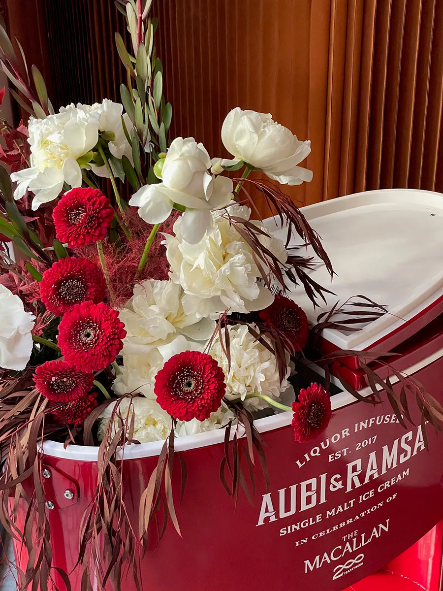 Red and white florals in vintage ice cream cart