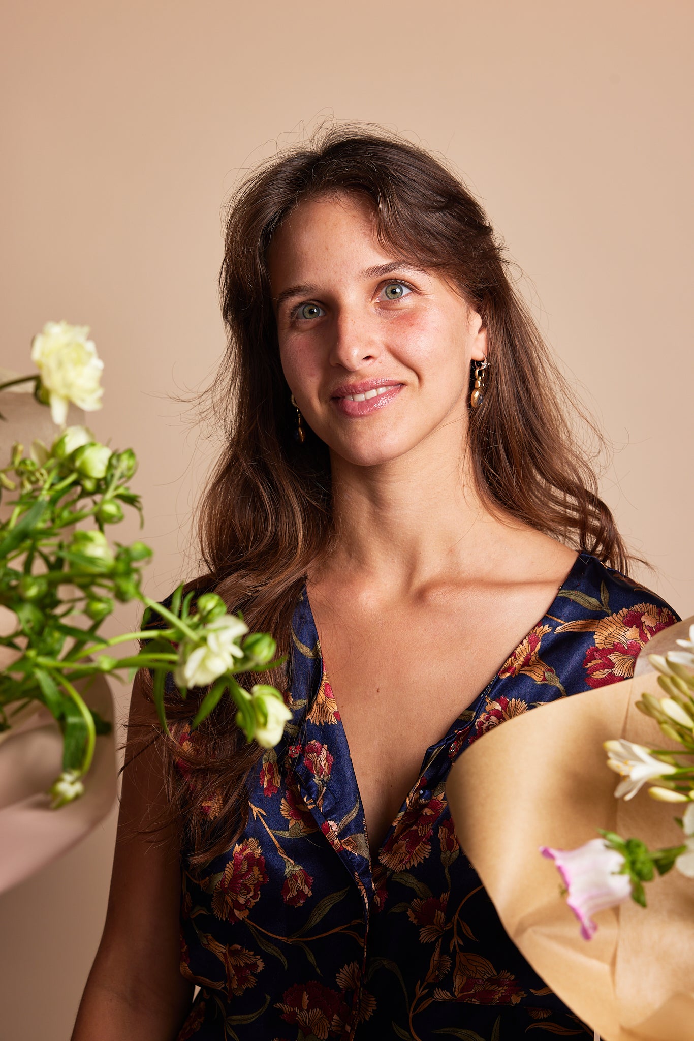 Florist embraces beauty with blooms and smile