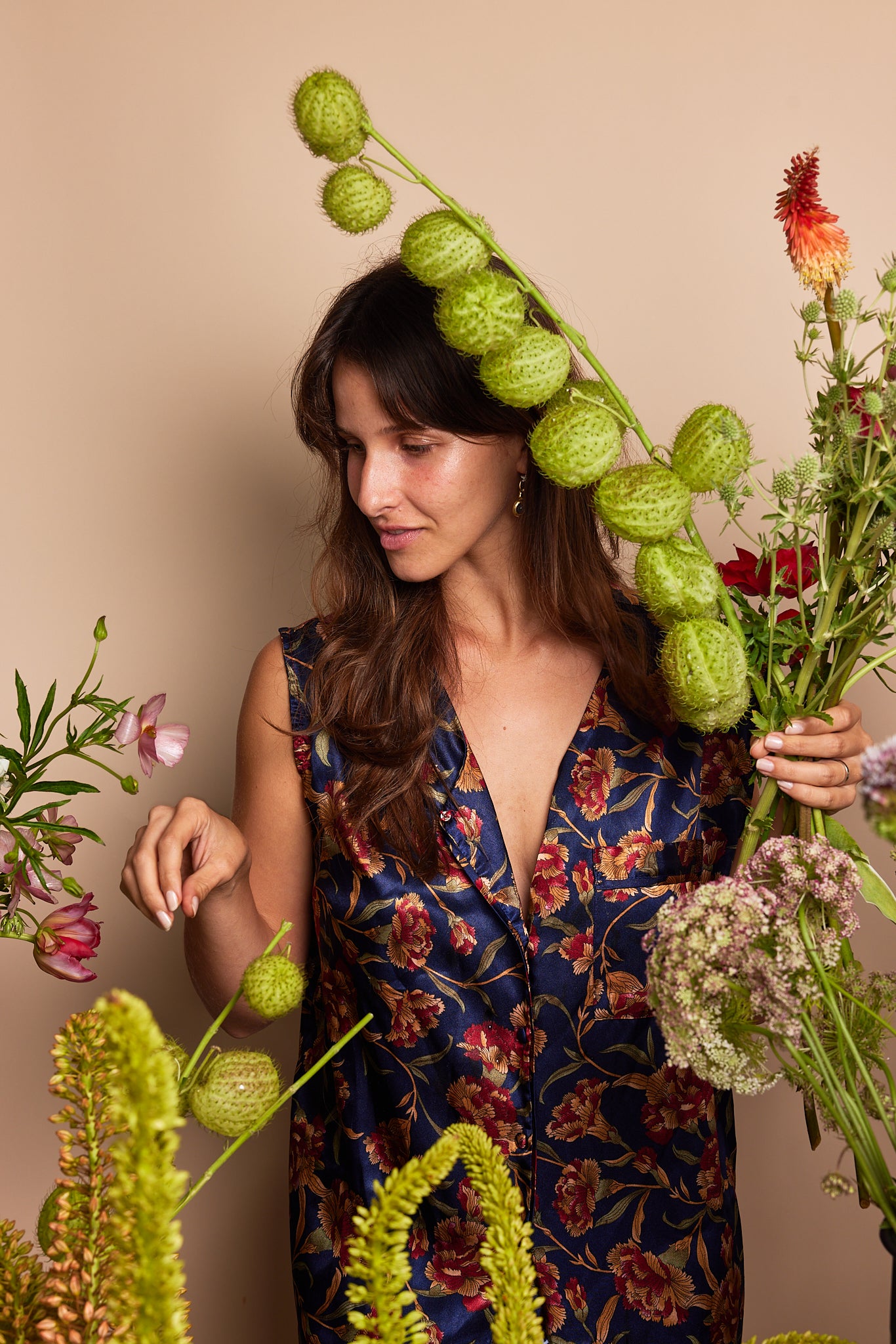 Green pods and vibrant flowers in artistic display