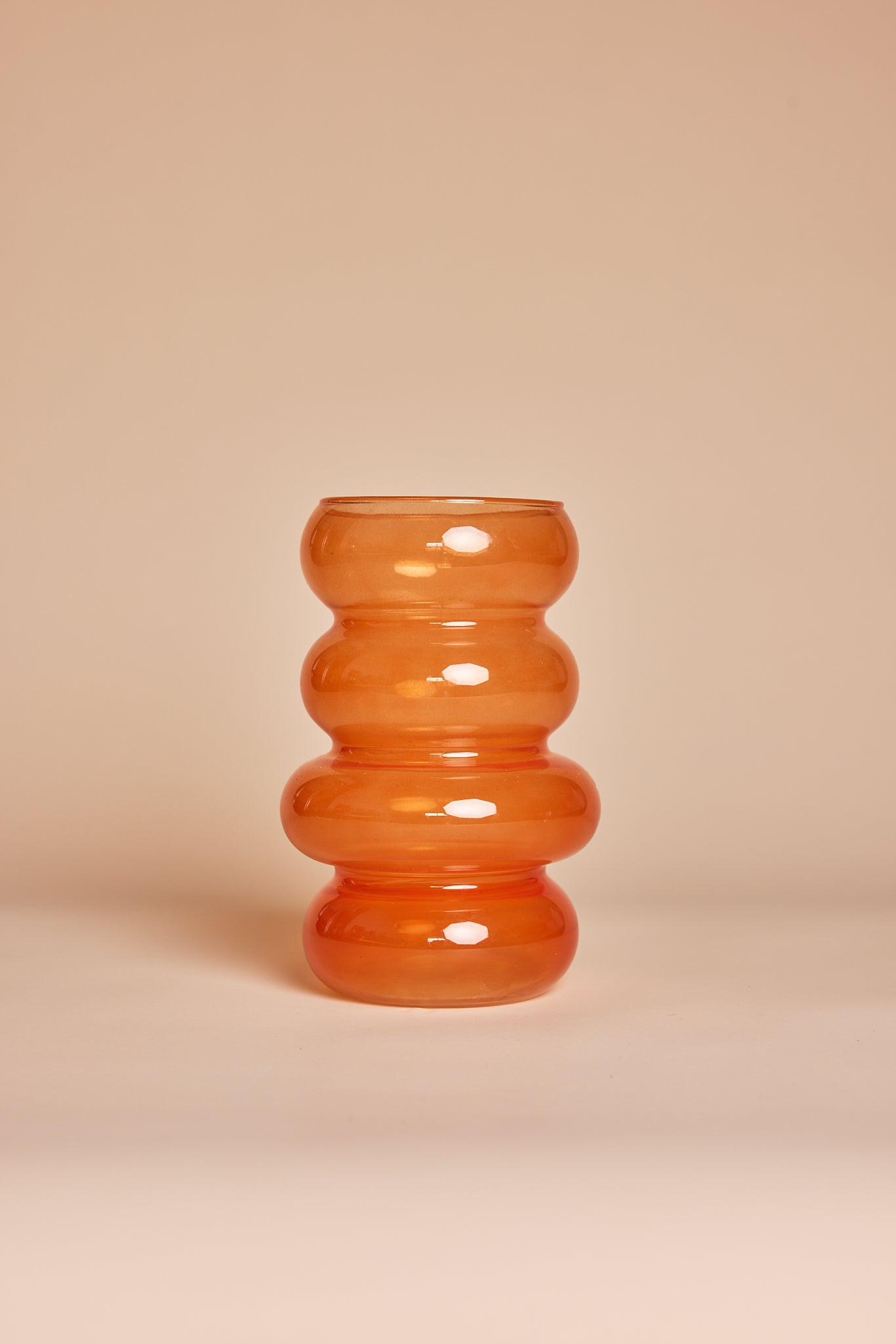 Translucent orange vase with bubbled texture
