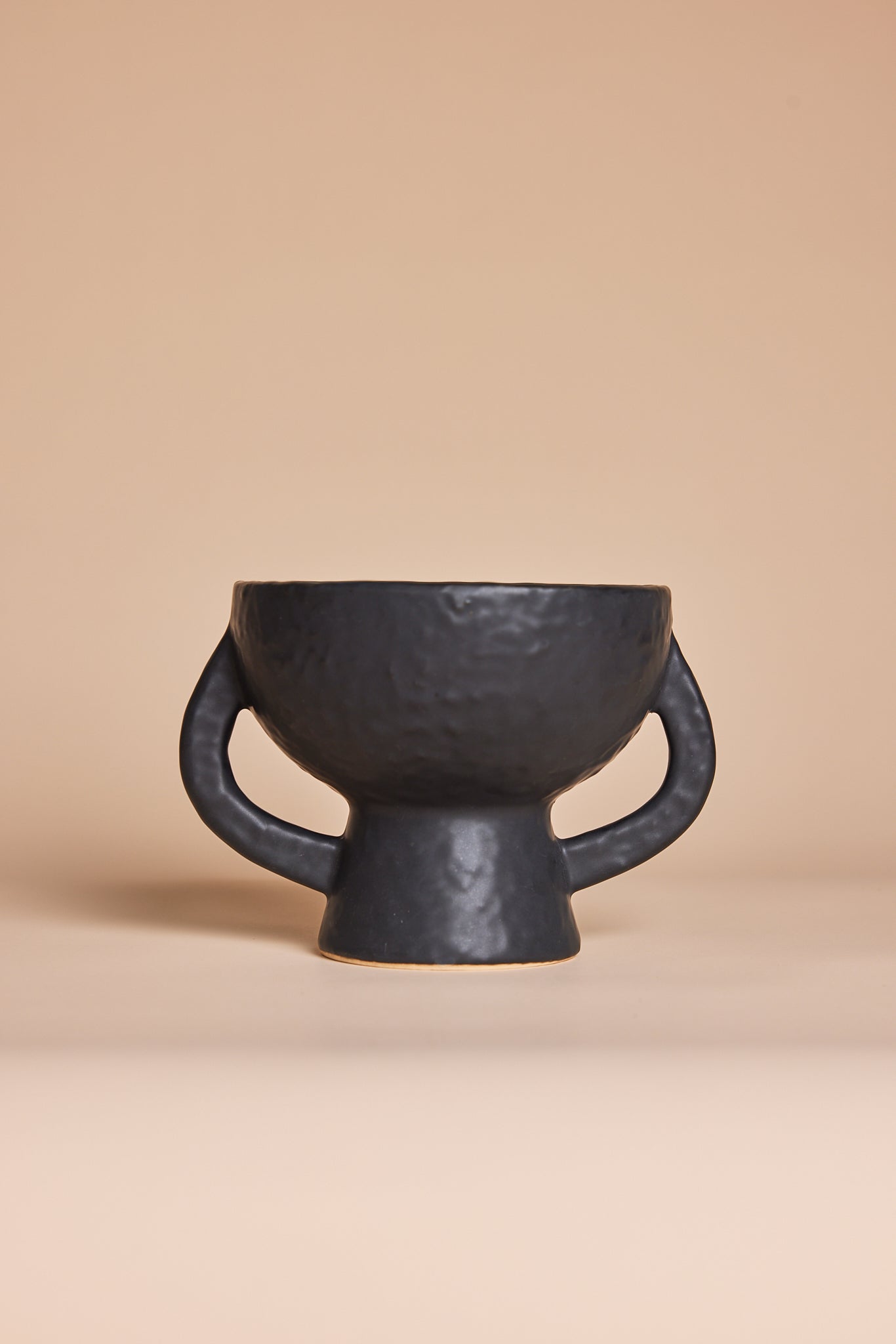 Black ceramic vase with sculptural twin handles